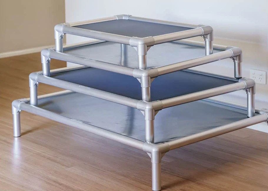 Four sizes of raised dog beds with silver metal frames