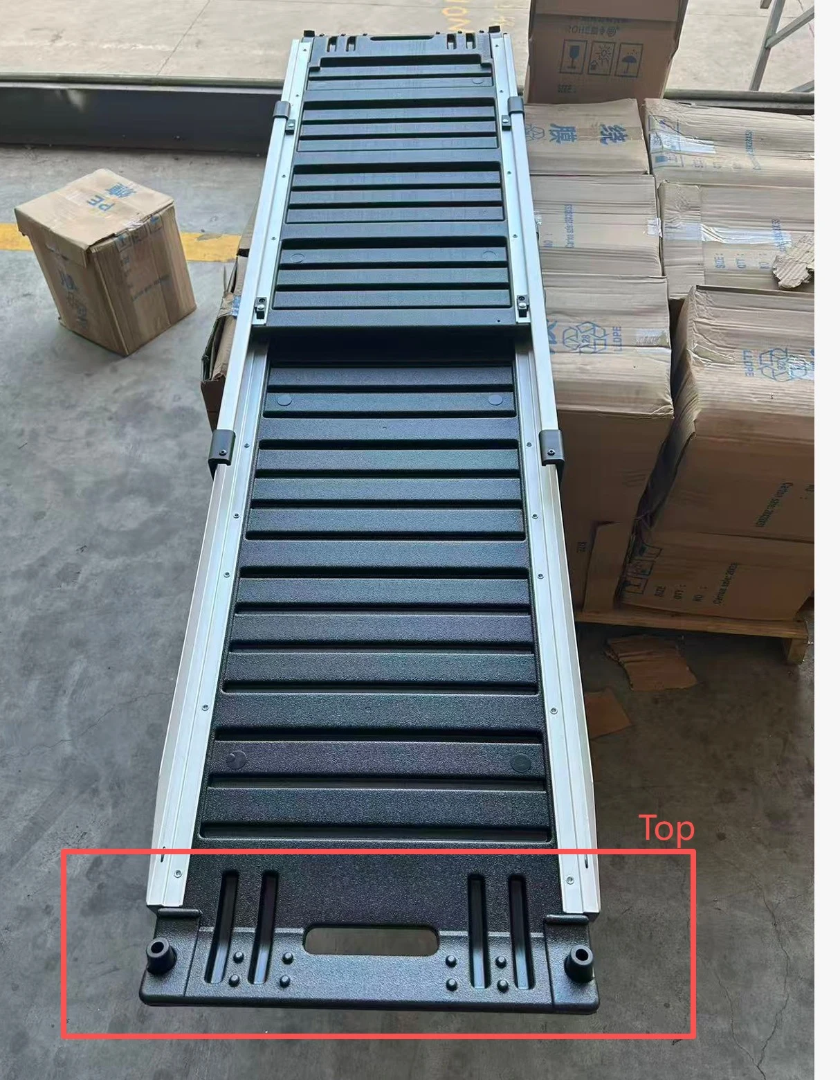 Supplied ramp development image showing a black ridged surface in a metal frame