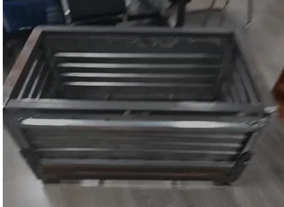 Supplied development photo of a rectangular metal slow feeder for small herbivores